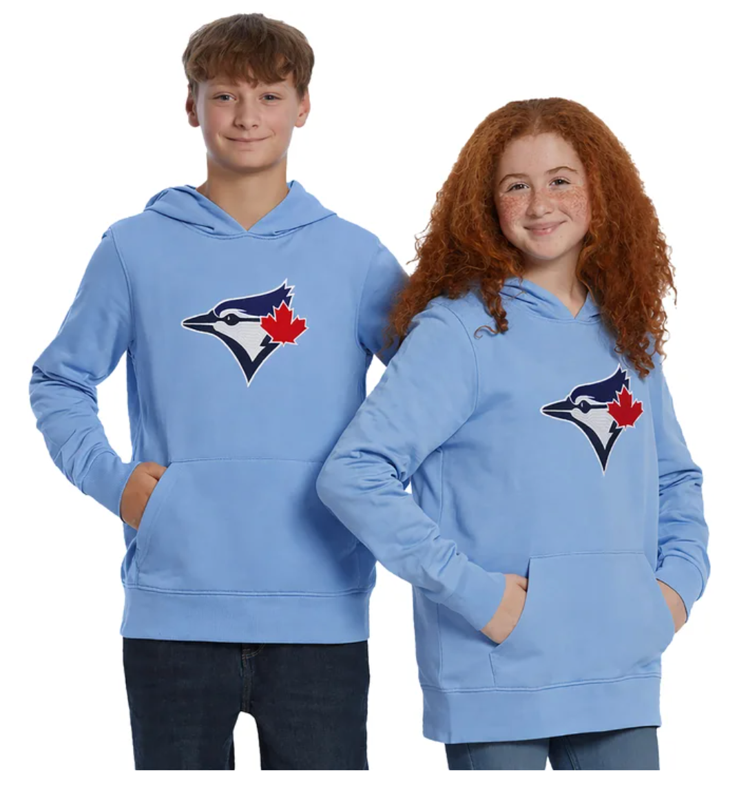 Two models, a boy and a girl, wearing matching light blue hoodies with the Toronto Blue Jays logo on the chest, set against a plain white background.